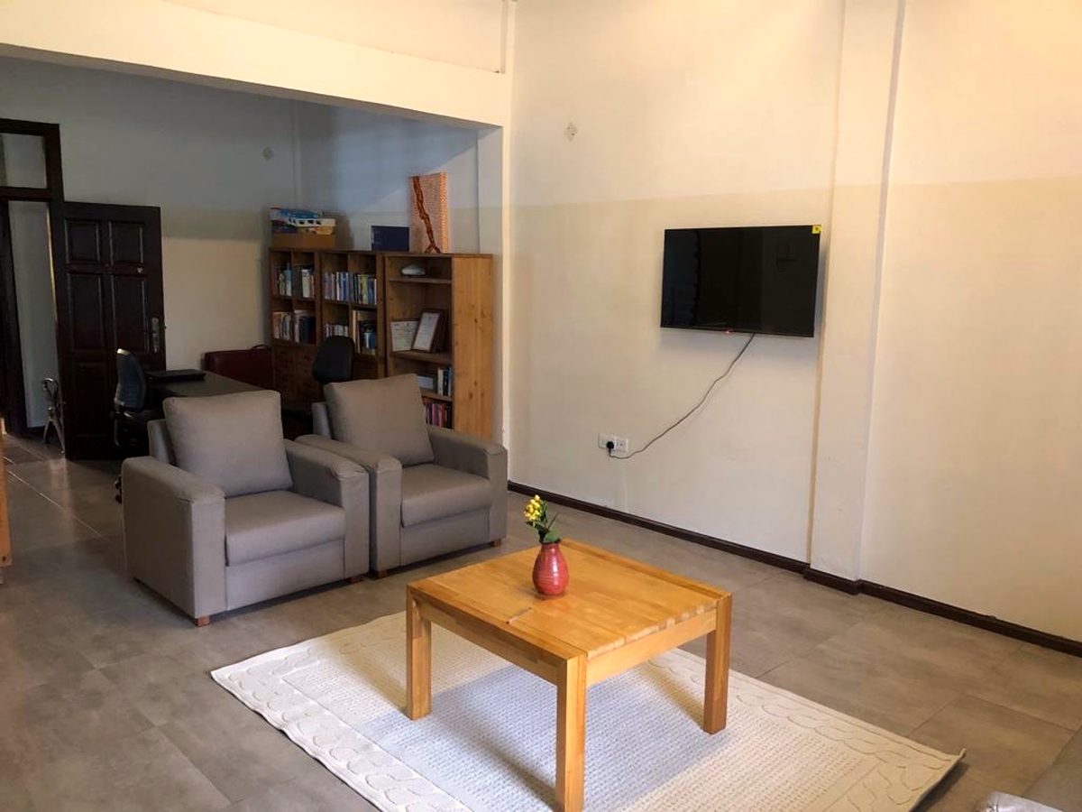 The shared living room of the apartment on the grounds of the GF Brafoyaw Medical Center