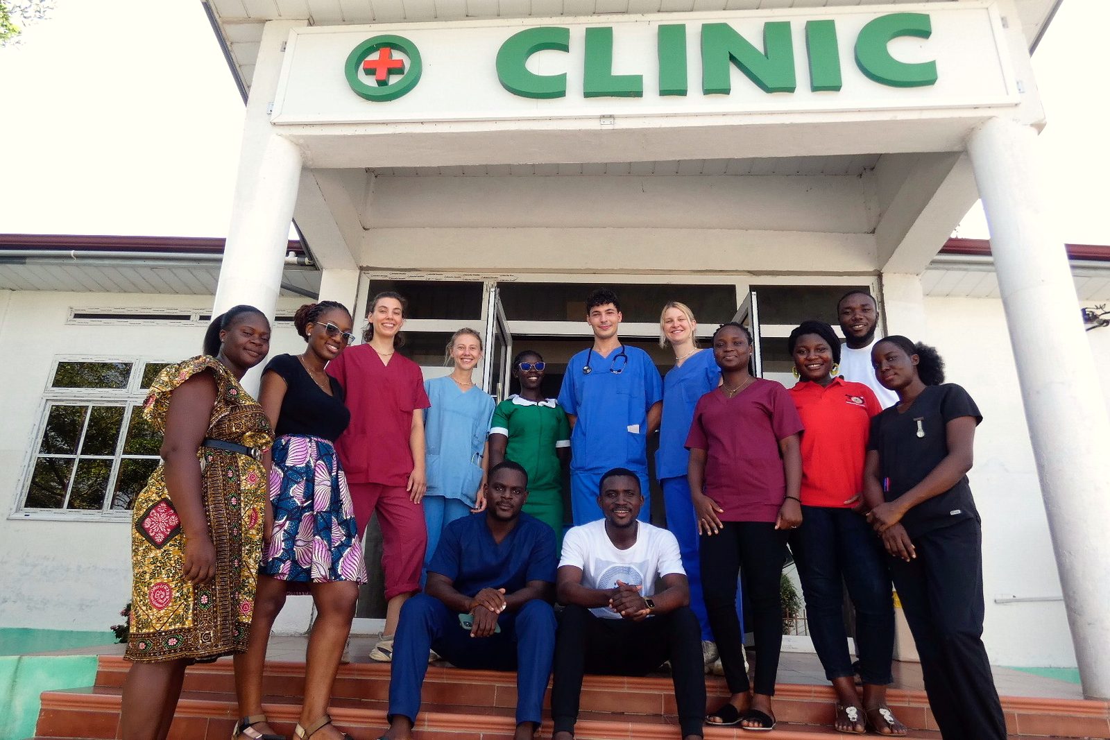 The MedXchange Africa team and visiting students together in front of the clinic in Cape Coast